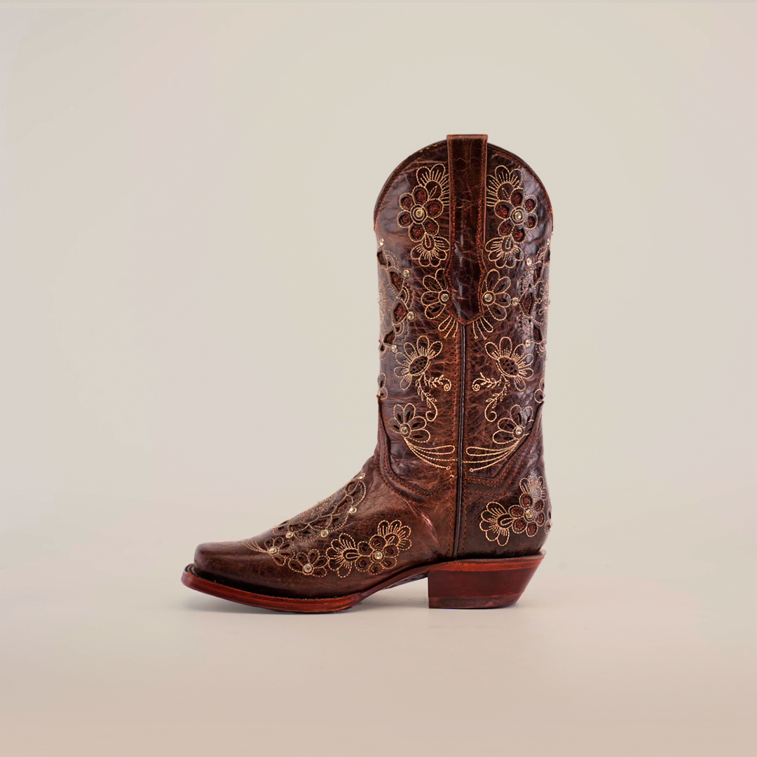 Against a plain white background, the Mayan Flower Crystals Chocolate boot is showcased. It features a short shaft, narrow square toe, classic heel, and intricate floral embroidery.