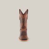 The Bombay Camel - Square Toe boot is displayed standing upright on a white background. It features decorative stitching, a square toe, and sturdy sole, all crafted from premium cowhide leather with a textured finish in classic Western style.