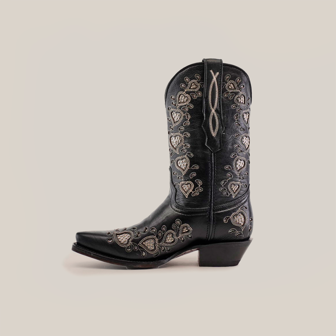 Explore the luxury of Studded Hearts Black - Short Shaft - Snip Toe boots, showcasing exquisite silver heart and floral embroidery along the shaft and foot. These handcrafted cowboy boots blend a pointed toe and medium heel, offering timeless elegance.