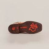 The image displays the brown tread sole of a Cater Honey Slip Resistant Sole Rodeo Toe boot, featuring a red logo and Texas Country in bold red. Its textured pattern offers reliable footing for those needing slip resistance.