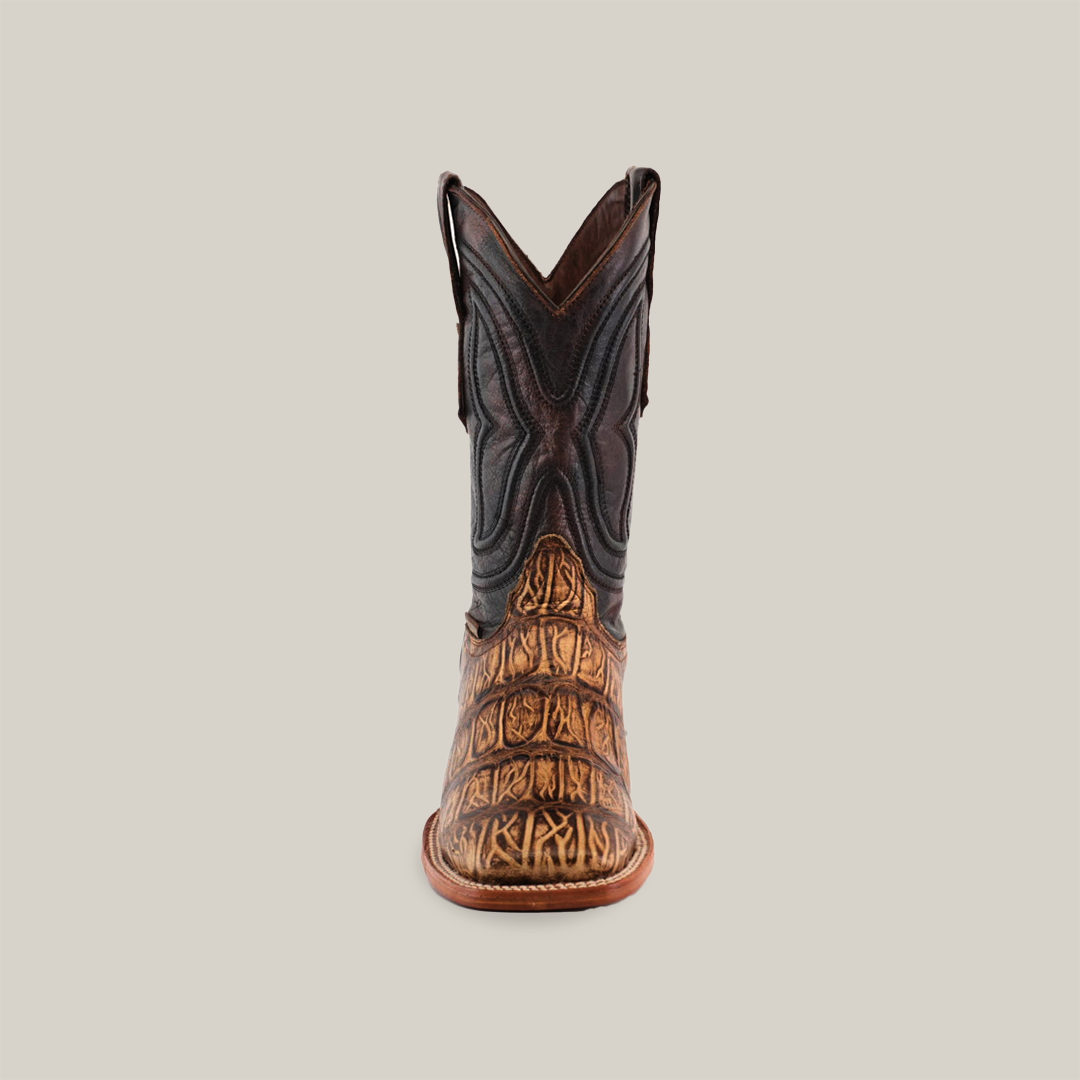 Front view of the Gator Print Orix - Square Toe boot, featuring a dark brown upper with a textured tan cowhide leather lower section, decorative stitching, and a rugged sole, all set against a plain white background.