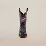 The Exotic American Alligator Patchwork Black Square Toe boot showcases a variety of textures and multicolored geometric patterns on exotic leather, with a slightly pointed toe and sturdy wooden sole, set against a plain white background.