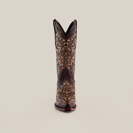 The Kiara Crystals Chocolate cowboy boot stands upright against a white background, showcasing its snip toe and intricate gold and bronze embroidery. Handcrafted with care, this stunning piece of western footwear is adorned with elaborate stitching in a rich dark brown color.