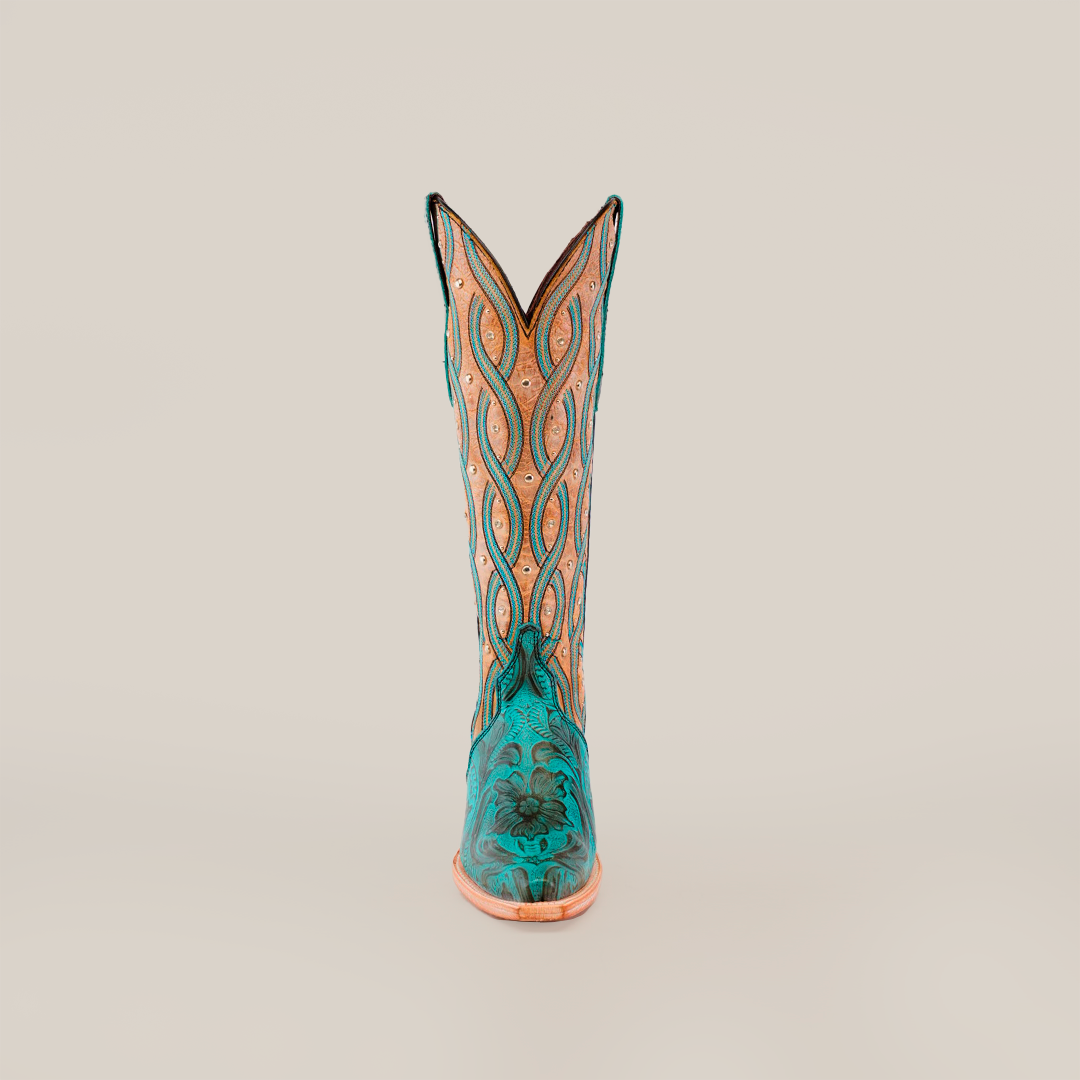 The Premier Turquoise Handtooled Flowers boot, in teal and tan, crafted from premium quality leather with intricate patterns and stitching, stands upright against a plain white background.